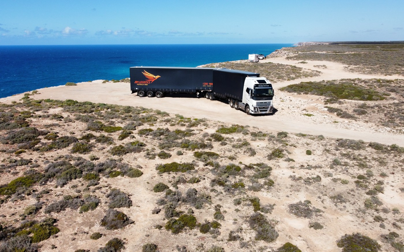 A JBM Logistics B-double on a remote interstate route