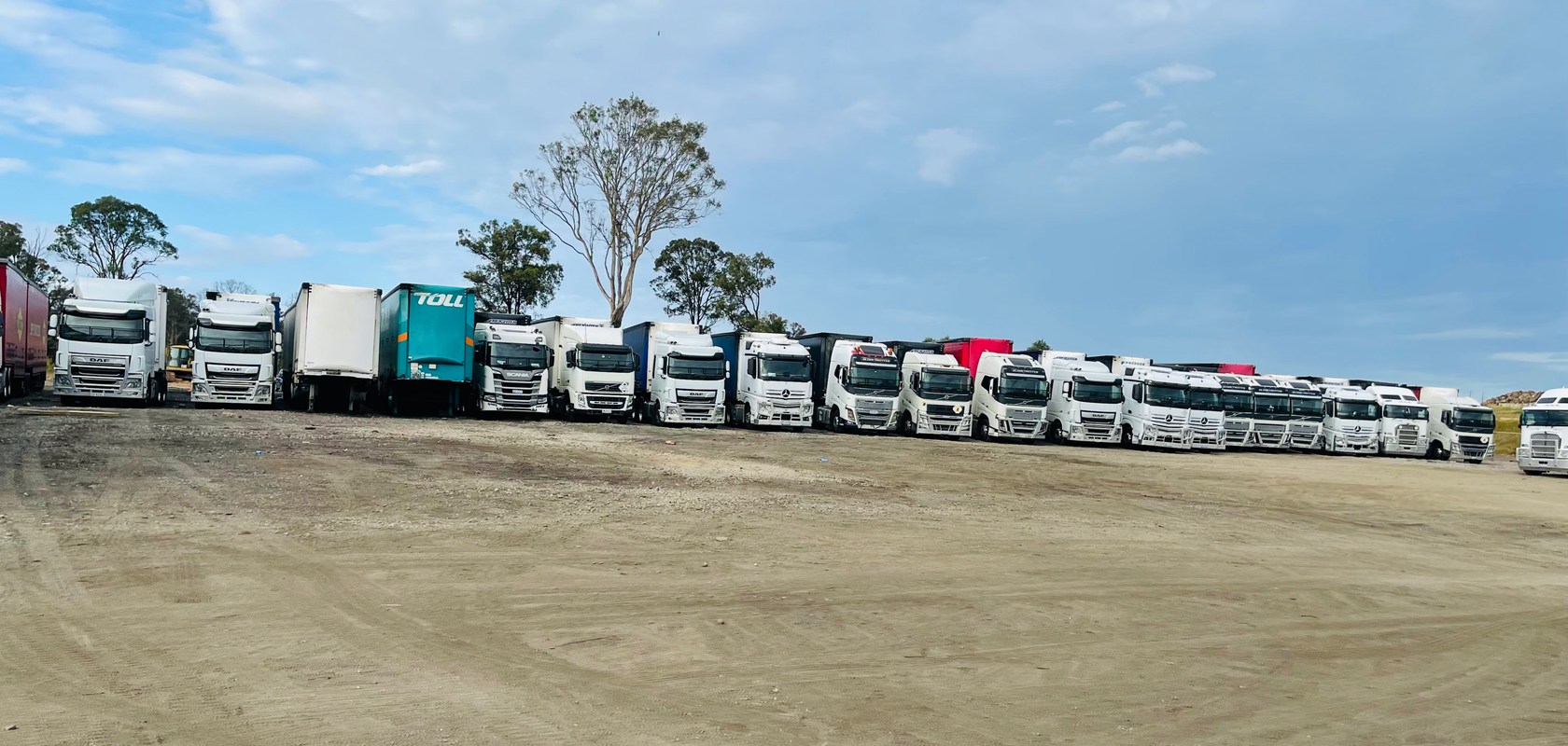 JBM Logistics prime movers lined up at the yard